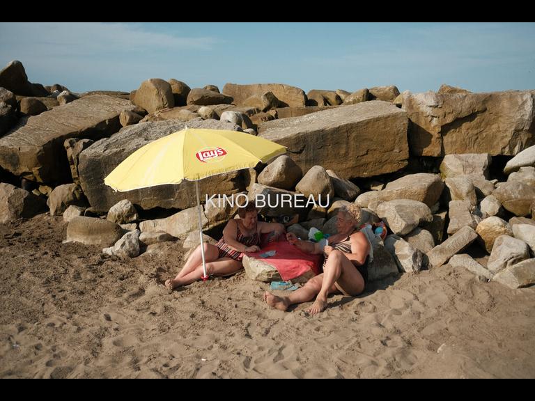 Women Playing Cards at the Beach